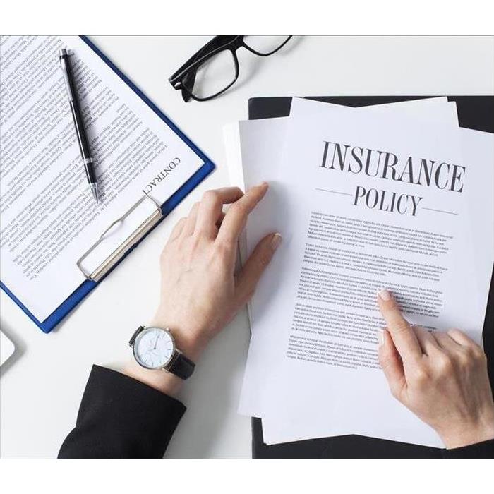 Photo of man reading insurance documents 